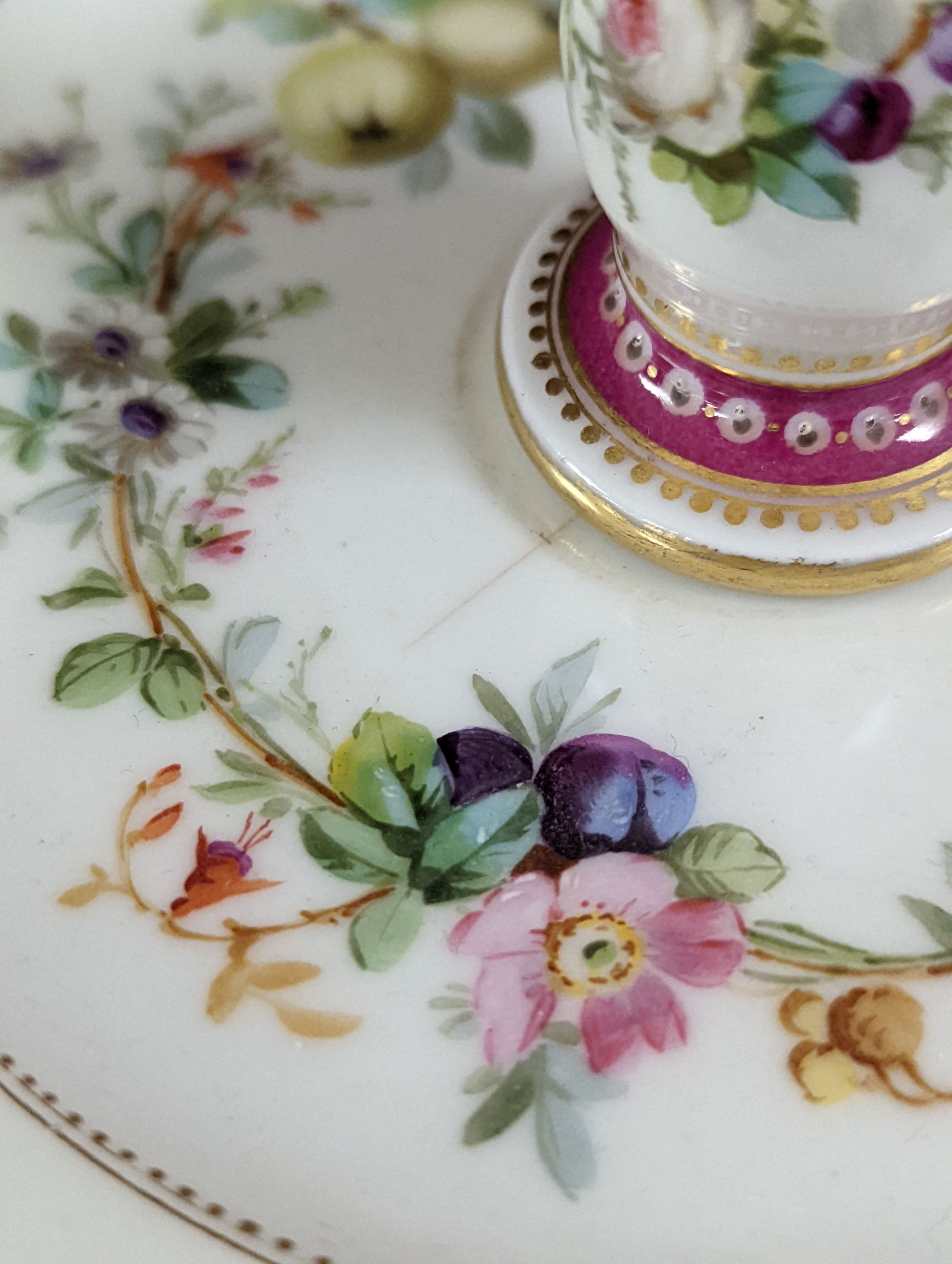 A late 19th century Paris porcelain floral part dessert service, with 2 pairs of comports, a three tier cake stand and eleven dishes.